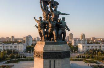Bronze Miners Glory monument in Karaganda against blue sky